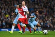 MANCHESTER, ENGLAND - FEBRUARY 21:  Raheem Sterling of Manchester City is challenged by Benjamin Mendy of AS Monaco during the UEFA Champions League Round of 16 first leg match between Manchester City FC and AS Monaco at Etihad Stadium on February 21, 2017 in Manchester, United Kingdom.  (Photo by Stu Forster/Getty Images)